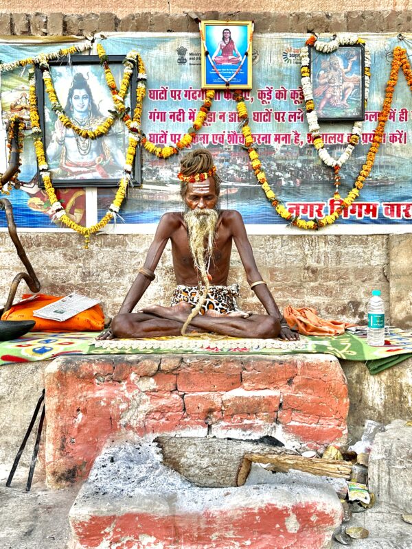 Sadhu meditating at the Ganges in Varanasi